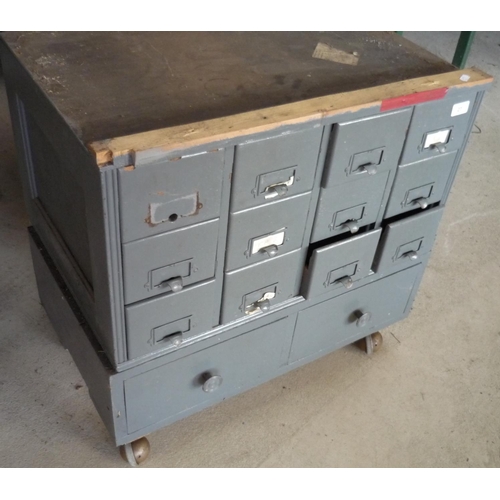 27 - Set of metal filing drawers with various items inside, on wheels