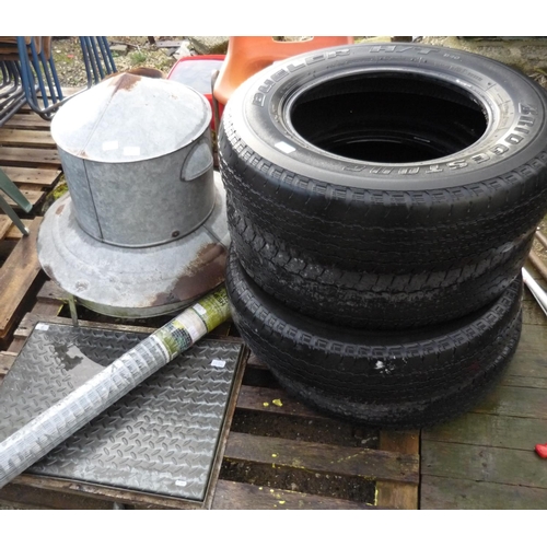 57 - Four Bridgestone tyres, a galvanised metal feeder, as new pack of metal welded mesh and a metal drai... 