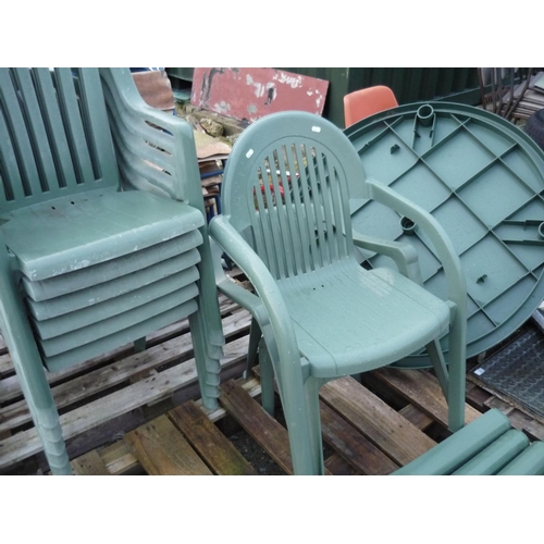 58 - Plastic patio table and eight stacking chairs
