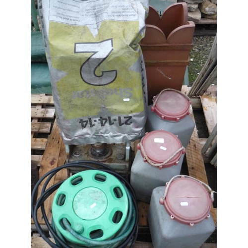 61 - Three plastic containers, a hose reel, greenhouse heater and a decorative chimney pot