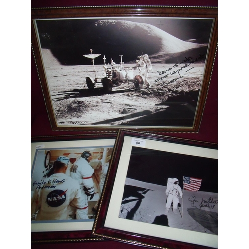 98 - Three framed and mounted Apollo Moon Mission photographs signed by various astronauts etc including ... 