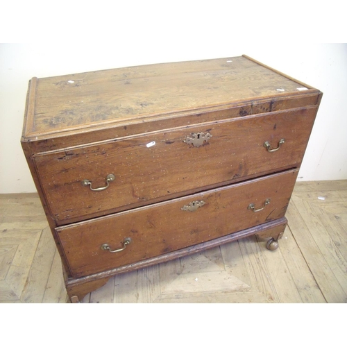 429 - Early 19th C elm chest of two drawers on raised bracket feet with later added casters (95cm x 49cm x... 
