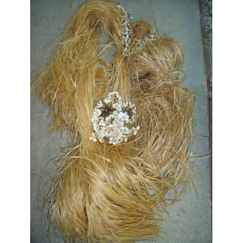 266 - Two Polynesian style grass skirts with shell waistbands
