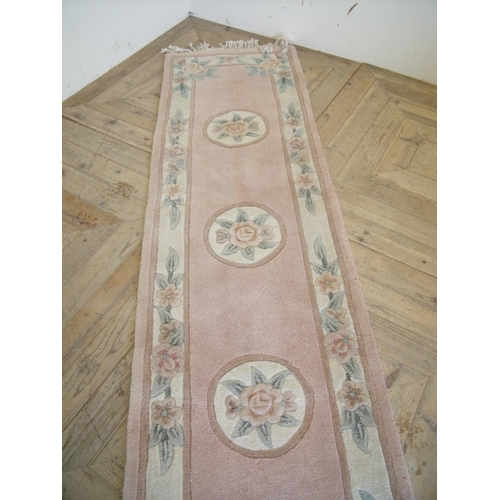 279 - Beige ground Chinese woollen runner rug (227cm x 64cm)