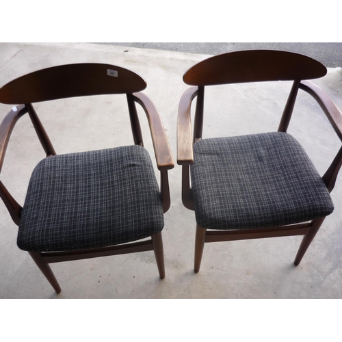 283 - Pair of circa 1970s teak framed armchairs