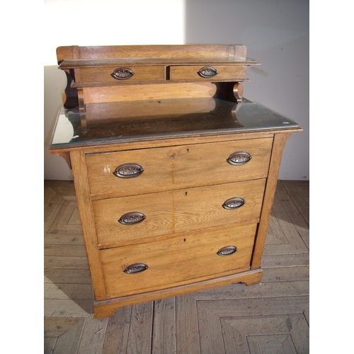 297 - Early 20th C oak dressing chest with a two drawer raised shelf above three drawers (width 91cm)