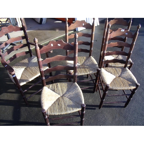 372 - Set of five (4+1) rush seated beech ladder back chairs