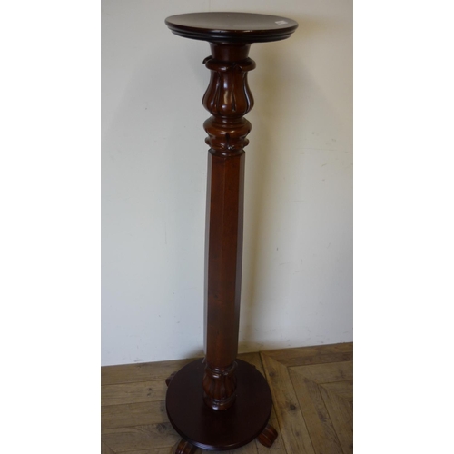 383 - Mahogany torcher stand with octagonal column and circular base (138cm high)