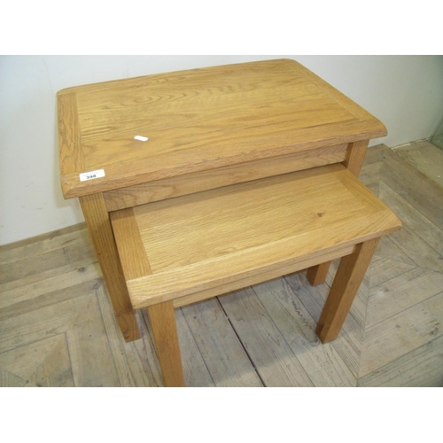 398 - Nest of two light oak rectangular occasional tables