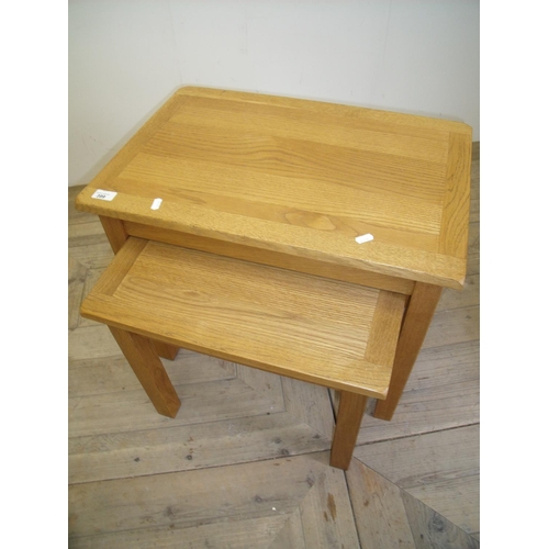 399 - Nest of two light oak rectangular occasional tables