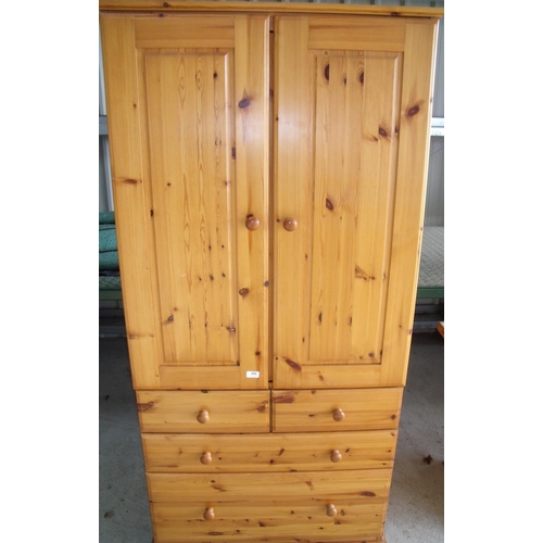 404 - Modern pine combination wardrobe with two cupboard doors above two long drawers