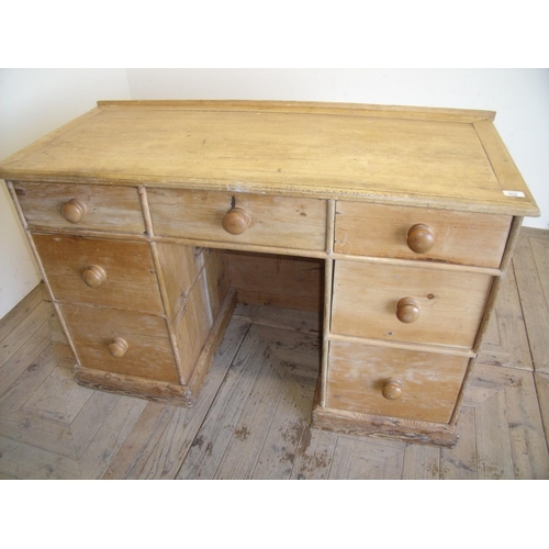 413 - Victorian pine kneehole desk with central drawer flanked by three drawers to each pedestal (122cm x ... 