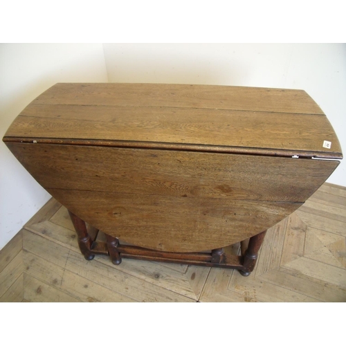 414 - 19th C oak drop leaf gate leg table with single drawer to one end, on turned supports