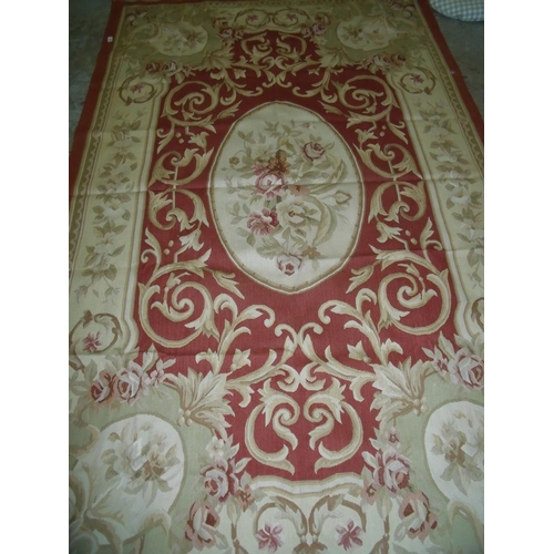 424 - Large red & beige ground needle point type rug (155cm x 248cm)