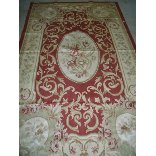 425 - Red & beige ground needle point rug (155cm x 249cm)