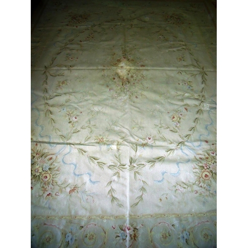 426 - Large beige ground needle point woollen carpet (272cm x 368cm)