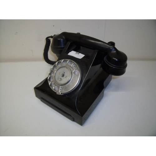 64 - A vintage black Bakelite style telephone