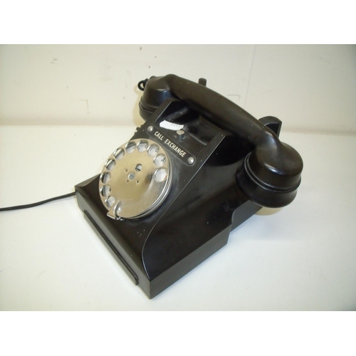 65 - A vintage black Bakelite style telephone