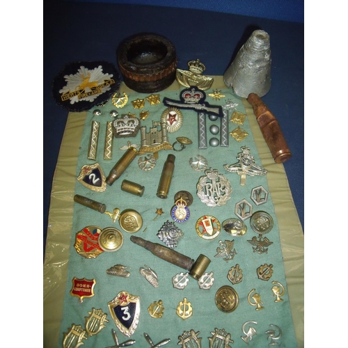 20 - Selection of various cap badges, a Civil Defence Corp lapel badge, inert ammunition, various Russian... 