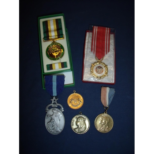 21 - Boxed ECOMOG Medal for Libya, various commemorative medals including a George V Queen Mary Coronatio... 