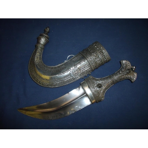 212 - Circa 1900 Saudi Arabian Jambiya/Khanjar, the hilt and scabbard covered overall with finely decorate... 
