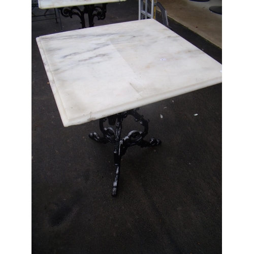 47 - Marble topped table on cast metal legs