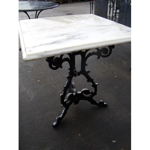 50 - Marble topped table on cast metal legs