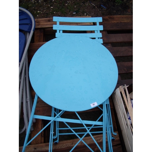 68 - Metal circular folding garden table and two matching folding chairs