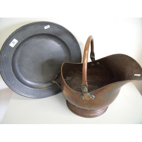 12 - 19th C large shallow pewter charger stamped EN (diameter 42cm) and a copper coal helmet (2)
