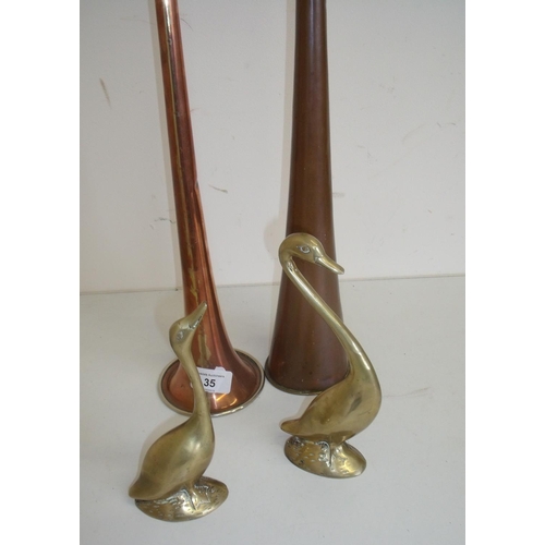 35 - Two copper coaching style horns and two brass figures of geese (4)