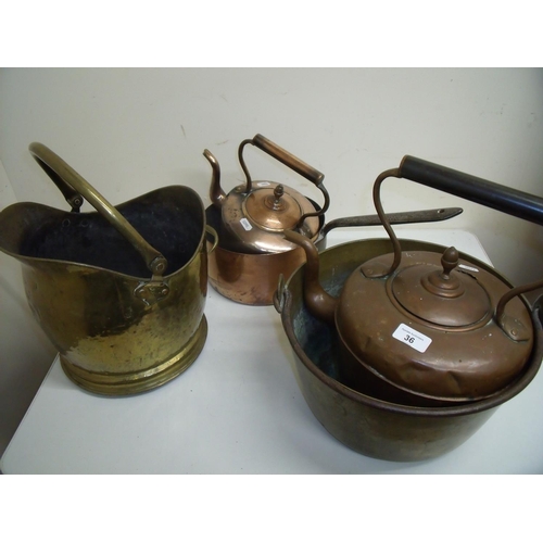 36 - Copper coal helmet, a brass jam pan, copper kettle with acorn finial, another similar smaller kettle... 