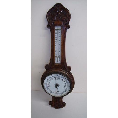 56 - Early 20th C carved oak framed wall barometer