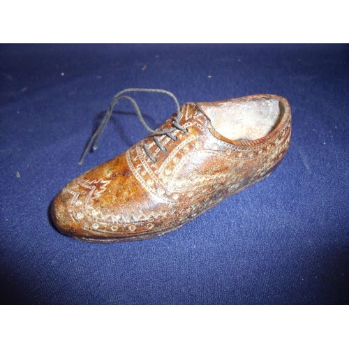 74 - Unusual cold painted bronze figure of a brogue type left brown shoe (length 12.5cm)