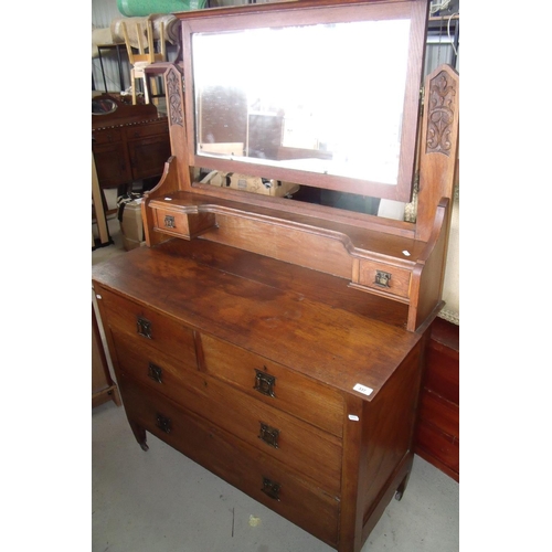 309 - Early 20th C oak dressing chest with raised back above two short and two long drawers (width 106cm)