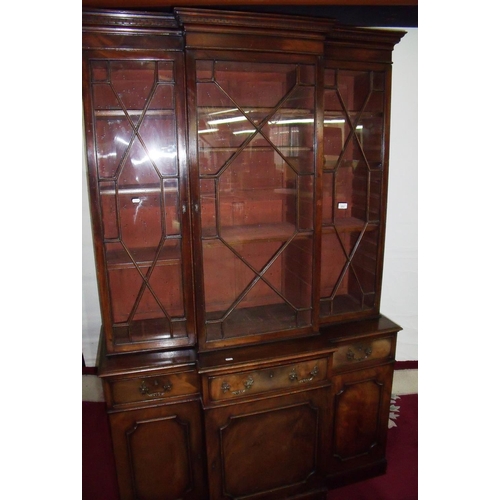 282 - 19th/20th C mahogany break front book case with stepped Greek key cornice above three glazed cupboar... 