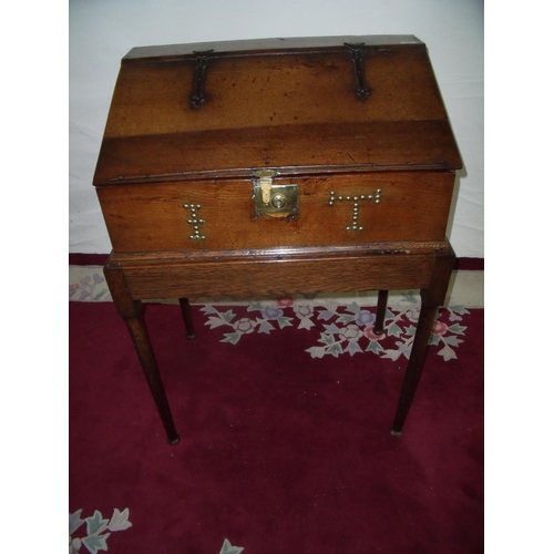 314 - 18th/19th C oak slope front desk on stand, the hinged rectangular slope top revealing a fitted inter... 