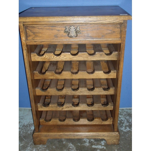 315 - Quality oak reproduction style wine cabinet with single drawer above five adjustable wine racks on r... 