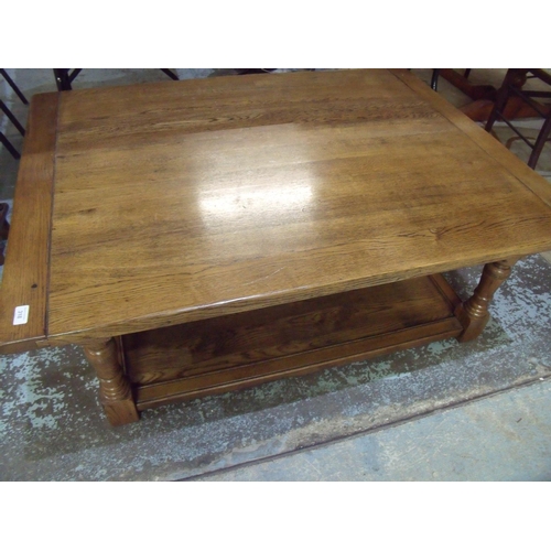 318 - Quality reproduction oak rectangular two-tier coffee table on turned supports (122cm x 92cm x 46cm)