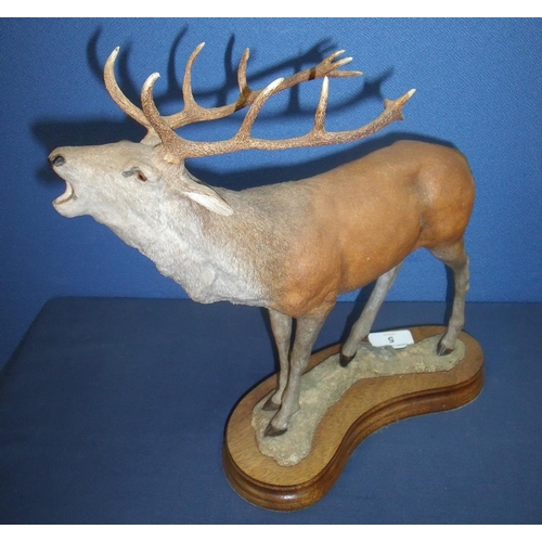 5 - Large modern figure of a stag mounted on wooden base (32cm high)
