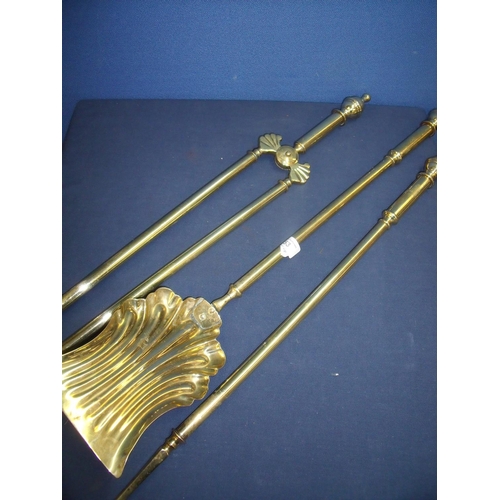 53 - Quality Victorian brass three piece fire companion set comprising of shell pattern shovel, tongs and... 