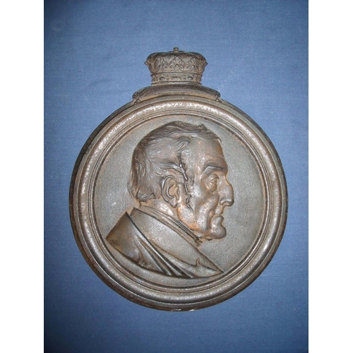 137 - Circular cast metal wall plaque depicting the bust portrait of the duke of wellington with coronet m... 