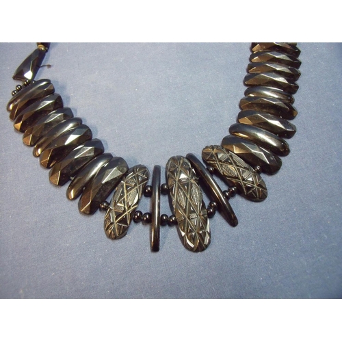 145 - Late Victorian multi-sectional Whitby jet necklace with various rectangular carved multi-faceted sec... 