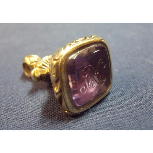 163 - Victorian yellow metal fob seal inset with rectangular amethyst coloured faceted stone with engraved... 