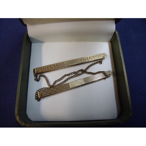 175 - Two 9ct gold tie clips with chains, with makers marks front and back N.G & G