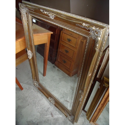 16 - Gilt framed bevelled edge wall mirror (82cm x 112cm)