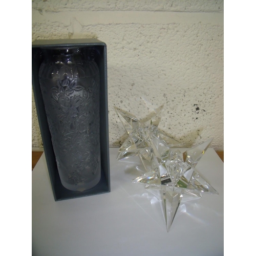 172 - Boxed modern Lalique vase (height 18cm) and two glass star shape candlesticks