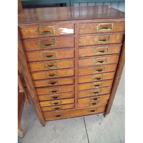341 - Early - mid 20th C oak office filing type bank of drawers, with two folding flaps enclosing twenty s... 
