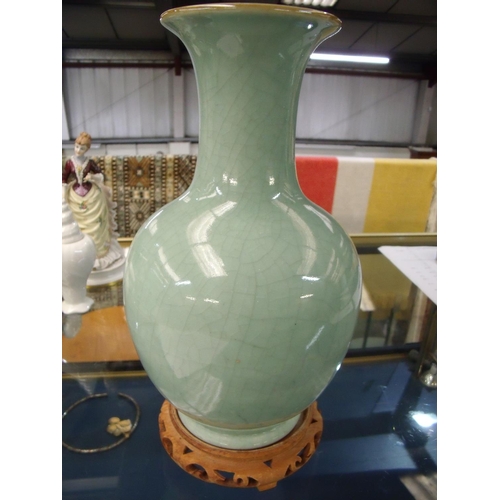 24 - Early to mid 20th C Chinese green crackle glaze vase with flared rim, mounted on hard wood base (hei... 