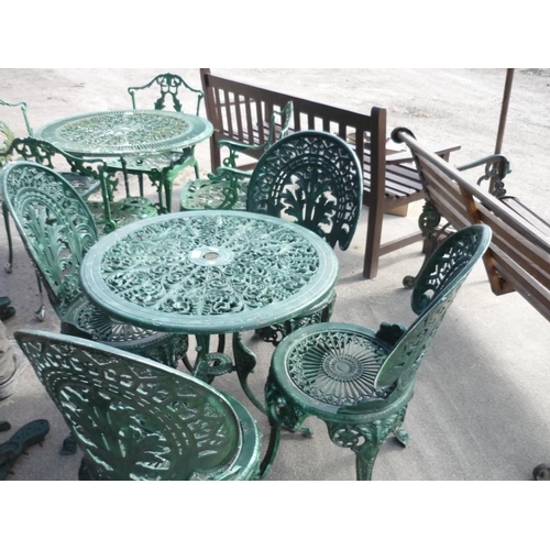 24 - Wrought iron garden table with four chairs