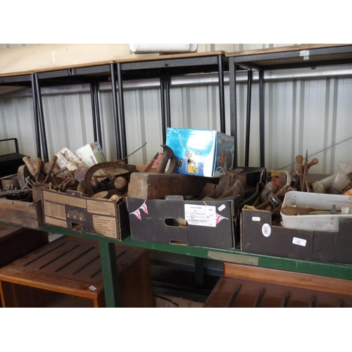 53 - Four boxes of various tools of various condition including old wooden planes, wood saws, horse tack ... 